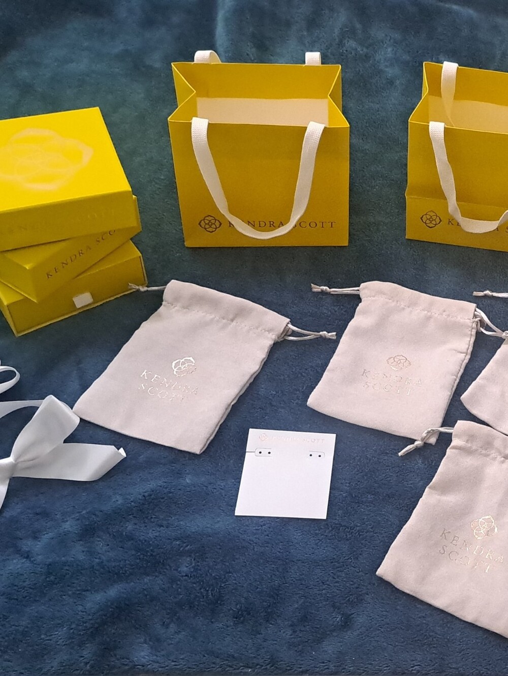 Kendra Scott Yellow Gift Bags with Cream Drawstring Pouches